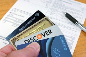 Man Holds Four Major Credit Cards